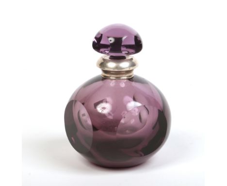 A faceted amethyst glass bottle and stopper with silver mounted rim. Stamped 800, 15cm.Condition report intended as a guide o