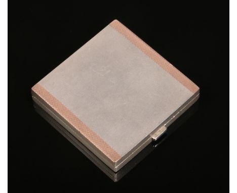 A George V silver powder compact by W. H. Manton Ltd and retailed by Asprey of London. With engine turned engraving and gold 