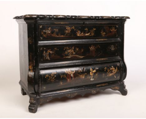 A 19th century Japanned bombé&nbsp;shaped table cabinet. With scalloped hinged top, canted corners, a single drawer to the ba