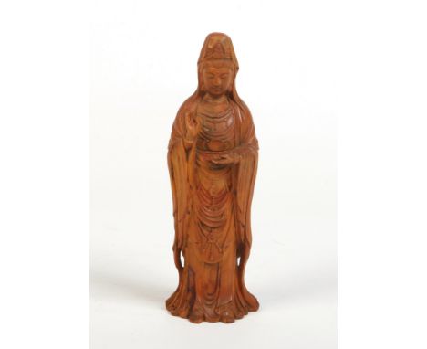 An early 20th century Chinese carved boxwood figure of Guanyin, 17cm.Condition report intended as a guide only.Chipping to th