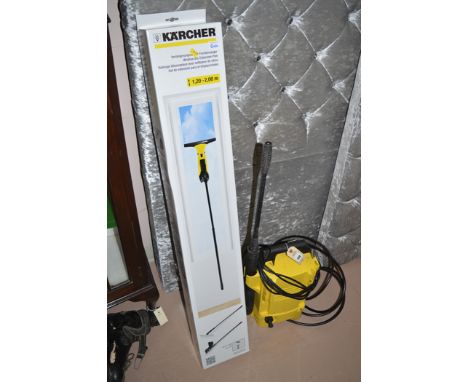 A Karcher K2 compact window vacuum and an extension pole.