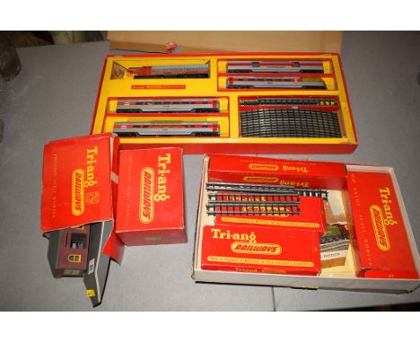 A Tri-ang electric model railroad set, 00/H0 gauge; railway stations and platforms; track; and other related items.