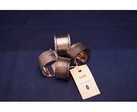 A George V silver napkin ring, by Sanders & Mackenzie, Birmingham 1935; a George VI silver napkin ring, Birmingham 1938; and 