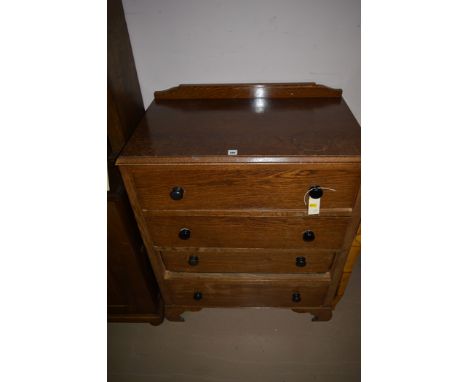 A 20th Century oak chest of four drawers, raised on bracket feet, 75cm wide.
