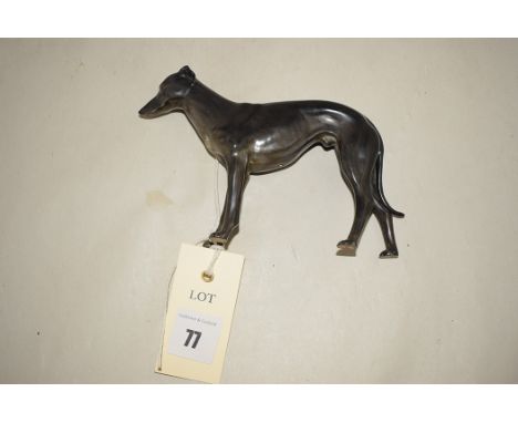 A Royal Crown Derby model of a greyhound, black grey glaze, height 10cm.