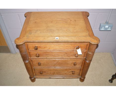 A 20th Century oak commode, fitted dummy drawers.