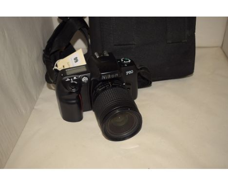 A Nikon F60 35mm camera in a Lowepro case.