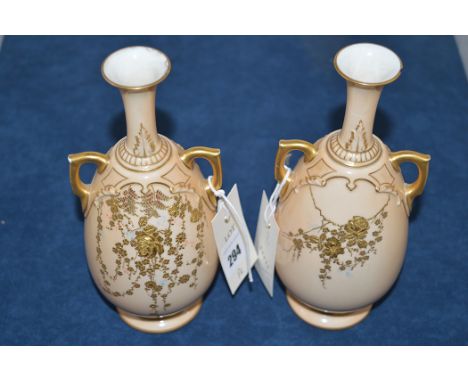 A pair of Royal Worcester blush and gilt decorated vases, shape No.1762, puce mark to base.