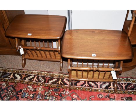 Two dark stained elm Ercol magazine racks.