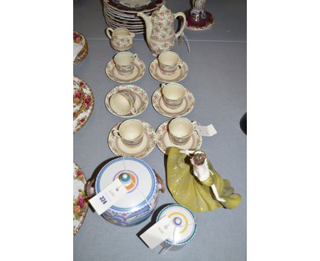 A Poole biscuit barrel; and a Poole preserve pot and cover, impressed 286, initialled "K.G."; Royal Doulton figure "Lynne" HN