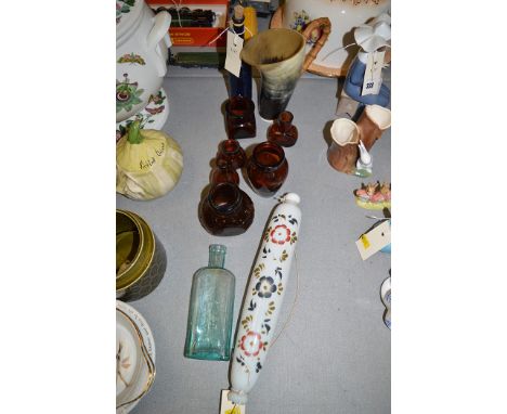 A Victorian opaque glass rolling pin with floral painted decoration; a Horn jug with Wangee handle; and various glass bottles