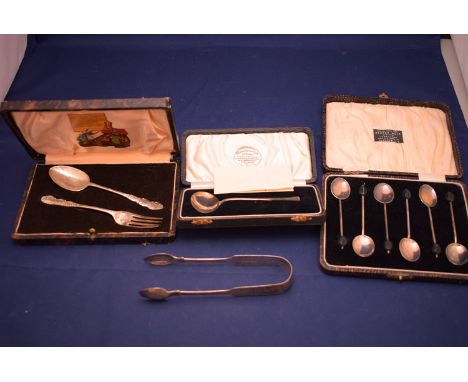 A pair of George IV silver sugar tongs, by Charles Boyton, London 1826; an Edward VII silver, christening set, by Charles Wil