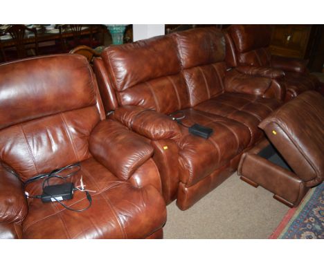 A modern three-piece leather sitting room suite, comprising: a two-seater, two armchairs with motorised reclining mechanisms;