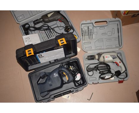A Performance PTM 13mm hammer drill; a Performance 710w impact drill, with hand tools in a trolley case; and a Performance Pr