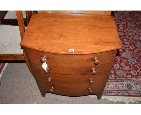 A Victorian mahogany commode with turned wooden handles, 61cms wide.