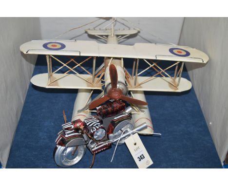 A tinplate model of a sea plane A.S.M.S. OK-FOL20; and a motorbike made from a drinks can.  (2)