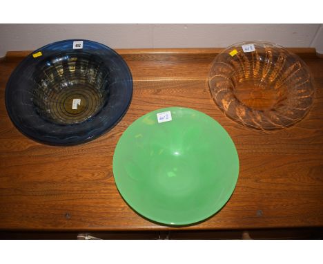 Barnaby Powell, for Whitefriars: a blue tinted glass bowl, with ribbed and lobe decoration; and another similar bowl in pale 