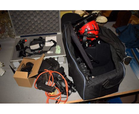 Recording lighting equipment, to include; lamps 220 volts; stands; a DC operated video light cased; and other items.