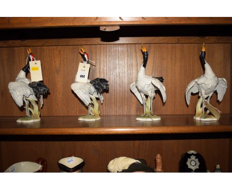 Goebel: four 'Manchurian Crane' ceramic models, all with impressed '38 149-25 1977' and inscribed 'Goebel W. Germany', 25cms 