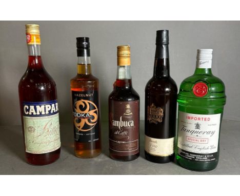 A selection of spirits (5) to include:Harrods Fino sherry, Hazelnut Todka, Campari, Sambucca Al Caffe, Imported Tanqueray Spe