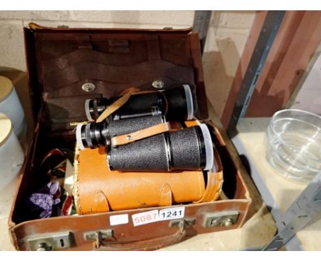 Leather briefcase containing ephemera and a cased pair of Empire 16 x 50 binoculars. Not available for in-house P&amp;P 