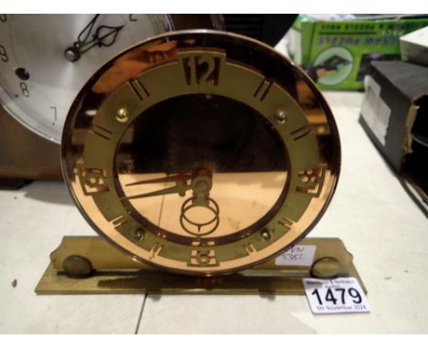 Brass mantel clock, with copper coloured mirrored dial. Not available for in-house P&amp;P