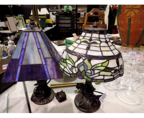 Two Tiffany style lamps, green and purple. All electrical items in this lot have been PAT tested for safety and have passed. 