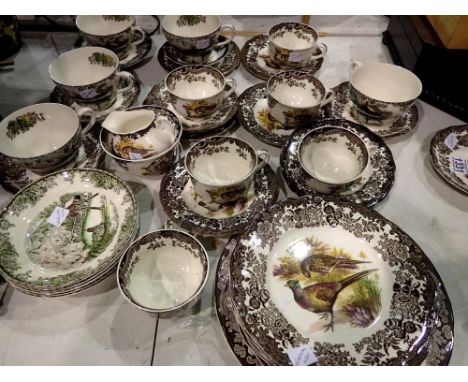 Royal Worcester Palissy thirty two piece tea service, in the Game series, and five oversized cups and saucers of similar desi