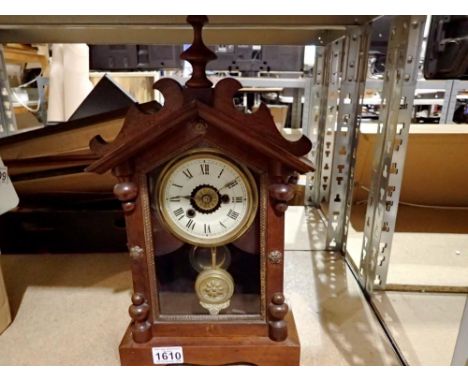 Oak cased mechanical mantel clock with key and pendulum, H: 44 cm. Not available for in-house P&amp;P