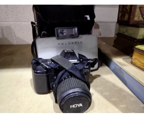 Cased Polaroid 210 camera with a Nikon F-801 35mm camera. UK P&amp;P Group 2 (£20+VAT for the first lot and £4+VAT for subseq