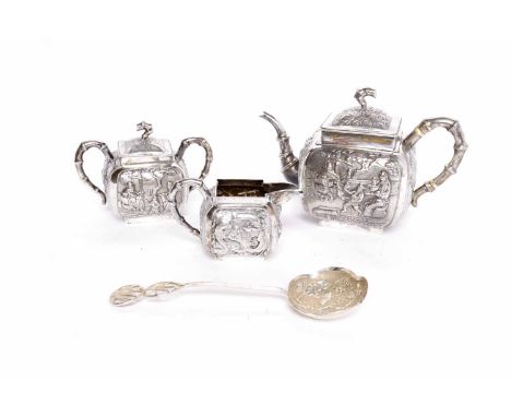 CHINESE SILVER THREE PIECE TEA SERVICEcomprising tea pot, sugar and cream, the hinged square pot lid with simulated bamboo fi