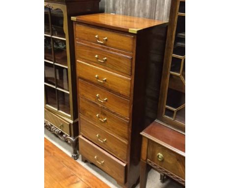 LATE 20TH CENTURY CHINESE ROSEWOOD PEDESTAL CHEST OF DRAWERSwith brass inset corners and seven drawers, on bracket feet, 61.5