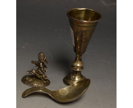 A George III silver caddy spoon, bright cut, London 1807, Godbehere, Wigan and Bult; a Scottish silver figure of a gunman and