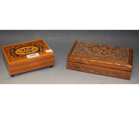 A carved wood playing card box; a musical cigarette box (2)