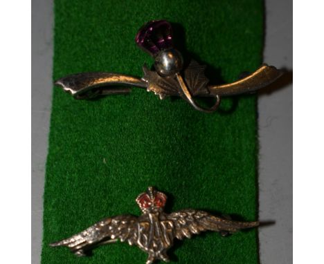 A RAF silver and enamel sweetheart brooch; a silver Scottish Thistle brooch