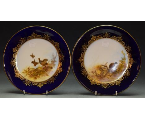 A pair of Royal Worcester plates, Partridge and Pheasant, signed G Johnson