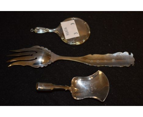 A silver caddy spoon, Birmingham 1843; a miniature hand mirror, Birmingham hallmark; a bright cut pickle fork (3)