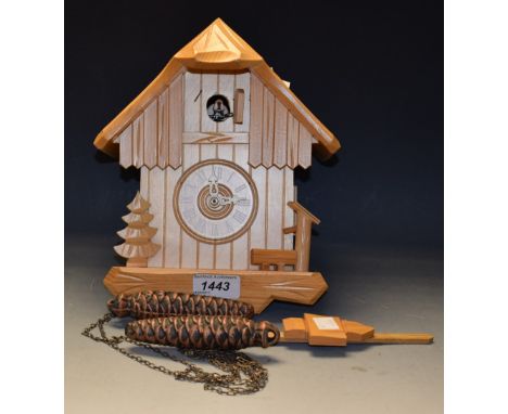 A German cuckoo clock, weights and pendulum 