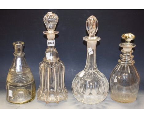 Decanters - an early Victorian cut decanter, three drip rings; a Victorian bell shape decanter, eight ribbed; two others (4)