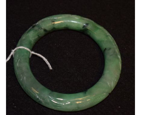 A Chinese style carved jade bangle