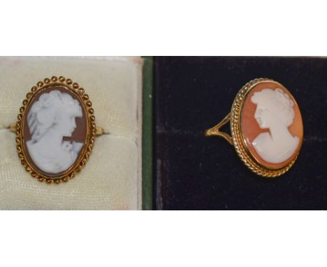 A 9ct gold shell cameo ring, oval portrait panel of a maiden, 9ct gold mount and shank;  another similar 9.7g gross 