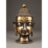 EIN BUDDHA-KOPF AUS BRONZE