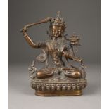 EINE SITZENDE FIGUR VON MANJUSHRI AUS BRONZE