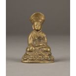 EINE SITZENDE FIGUR VON LAMA AUS BRONZE
