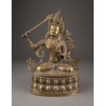 EINE SITZENDE FIGUR VON MANJUSHRI AUS BRONZE