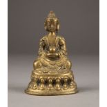EINE STIZENDE FIGUR VON AMITABHA AUS BRONZE