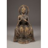 EINE SITZENDE BUDDHA-FIGUR MIT AURA