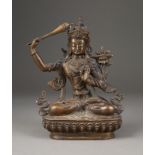 EINE SITZENDE FIGUR VON MANJUSHRI AUS BRONZE