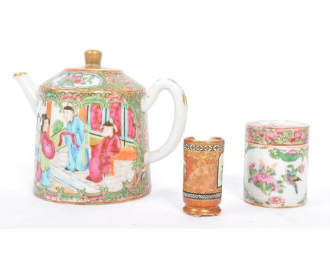 A Chinese 19th century famille rose small teapot with foliate decoration being hand painted together with a similar small, li