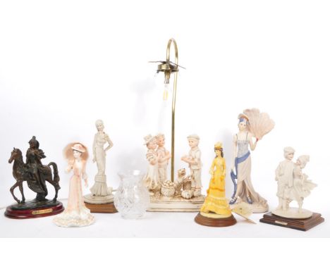 A 20th century vintage Capodimonte lamp base modelled in the form of three children harvesting vegetables, alongside a collec